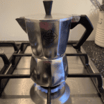 Photo of a Moka Pot with the lid down on a stovetop