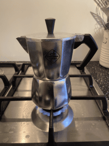 Photo of a Moka Pot with the lid down on a stovetop