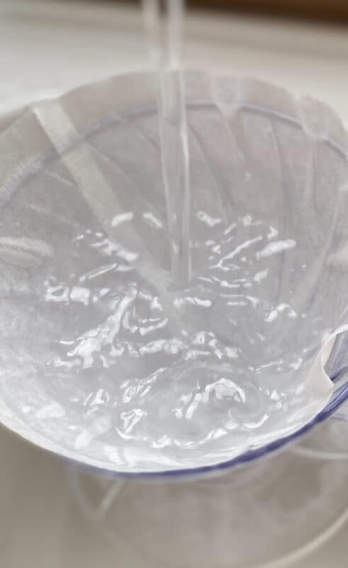 Image: V60 with filter paper filled with running water