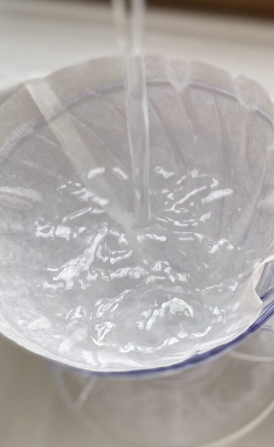 Image: V60 with filter paper filled with running water
